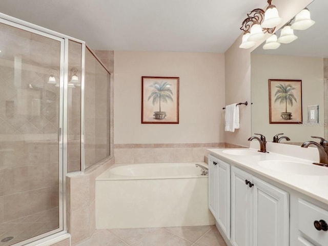 bathroom featuring tile patterned flooring, vanity, and separate shower and tub