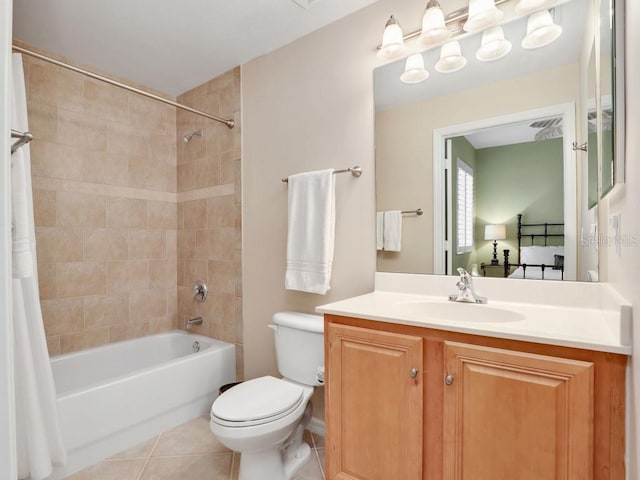 full bathroom featuring tile patterned floors, shower / bathtub combination with curtain, vanity, and toilet