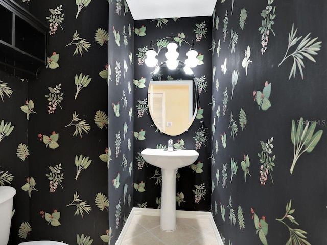 bathroom featuring tile patterned floors and toilet