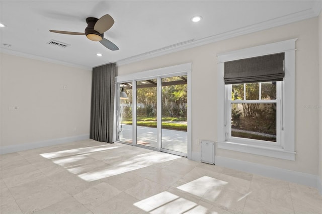 spare room featuring crown molding and ceiling fan