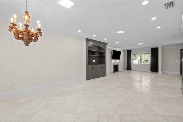 unfurnished living room featuring crown molding, a fireplace, and an inviting chandelier