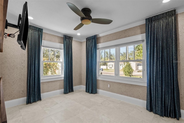 unfurnished room with crown molding and ceiling fan