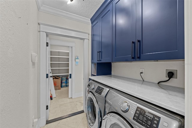 clothes washing area with washer and dryer, ornamental molding, cabinets, and a textured ceiling