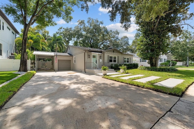 ranch-style home with a garage and a front lawn