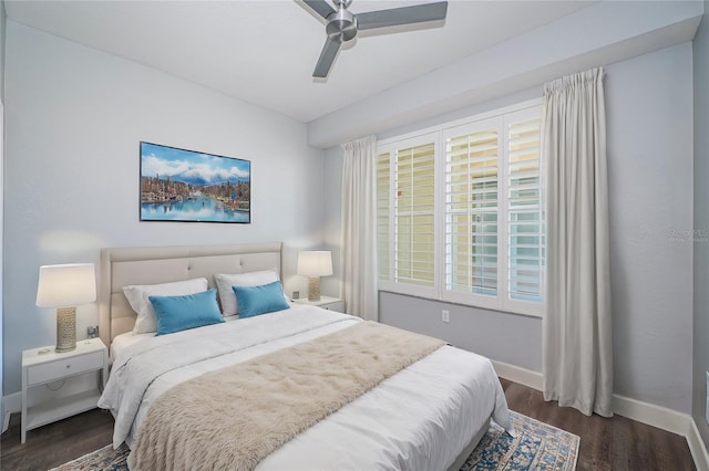 bedroom with ceiling fan and dark hardwood / wood-style flooring