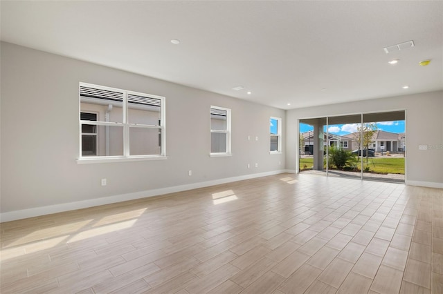 spare room featuring light wood-type flooring