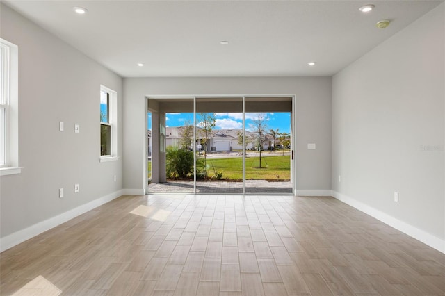 spare room with light wood-type flooring