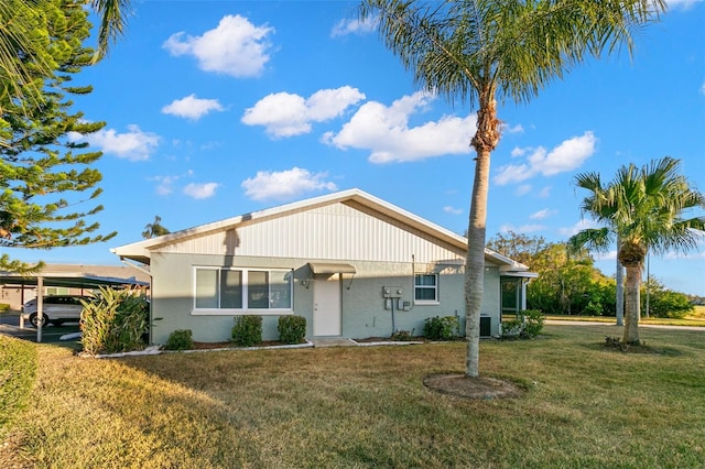 2232 Greenwich Dr Unit 56, Sun City Center, FL 33573 - view of front facade with a front lawn and stucco siding