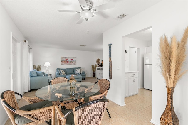 2232 Greenwich Dr Unit 56, Sun City Center, FL 33573 - dining area with visible vents, light tile patterned floors, and ceiling fan