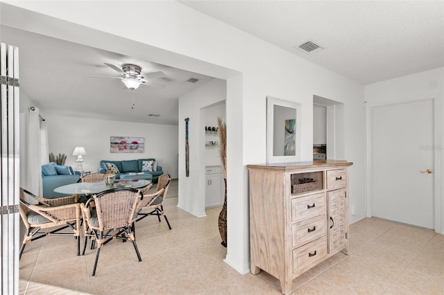 2232 Greenwich Dr Unit 56, Sun City Center, FL 33573 - dining room with light tile patterned flooring, ceiling fan, and visible vents