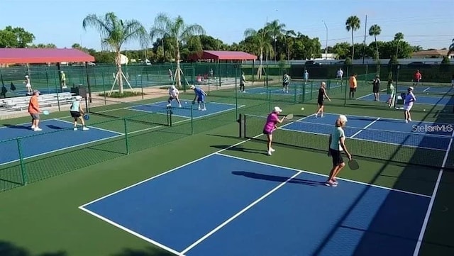 2232 Greenwich Dr Unit 56, Sun City Center, FL 33573 - view of tennis court featuring fence and community basketball court