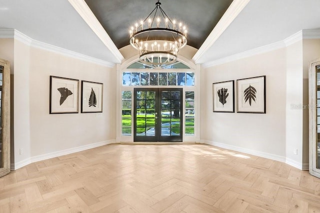 entryway featuring light parquet flooring, an inviting chandelier, crown molding, and french doors