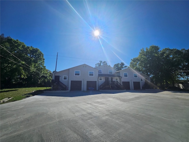 5802 Mohr Loop Unit 5802-5804-5806-5808, Tampa, FL 33615 - view of front of property featuring stairs, an attached garage, and driveway