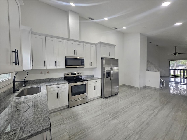 5802 Mohr Loop Unit 5802-5804-5806-5808, Tampa, FL 33615 - kitchen featuring stainless steel appliances, a sink, stone countertops, high vaulted ceiling, and a ceiling fan