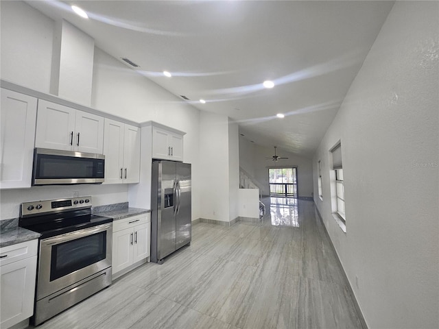 5802 Mohr Loop Unit 5802-5804-5806-5808, Tampa, FL 33615 - kitchen featuring stainless steel appliances, a ceiling fan, baseboards, white cabinetry, and high vaulted ceiling