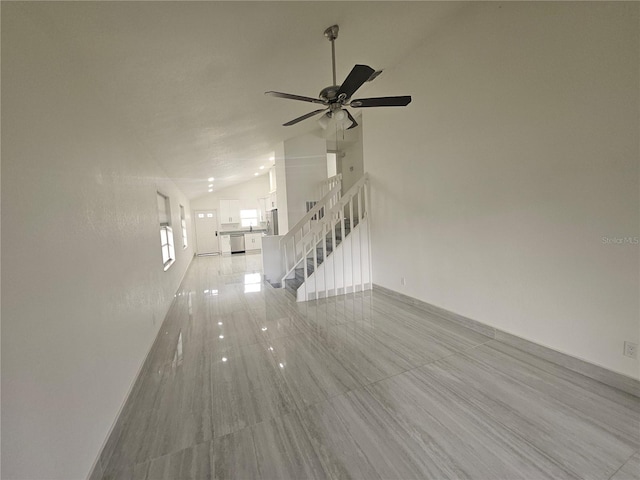5802 Mohr Loop Unit 5802-5804-5806-5808, Tampa, FL 33615 - unfurnished living room with stairway, a ceiling fan, light tile patterned floors, high vaulted ceiling, and baseboards