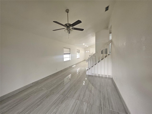 5802 Mohr Loop Unit 5802-5804-5806-5808, Tampa, FL 33615 - unfurnished living room with baseboards, ceiling fan, and stairs