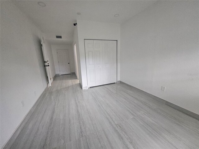 5802 Mohr Loop Unit 5802-5804-5806-5808, Tampa, FL 33615 - unfurnished bedroom with wood finished floors, a closet, and baseboards