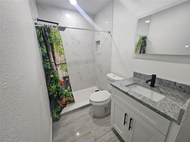 5802 Mohr Loop Unit 5802-5804-5806-5808, Tampa, FL 33615 - bathroom with a textured wall, toilet, vanity, a shower stall, and marble finish floors