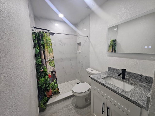 5802 Mohr Loop Unit 5802-5804-5806-5808, Tampa, FL 33615 - full bath featuring a textured wall, vanity, toilet, and a shower stall