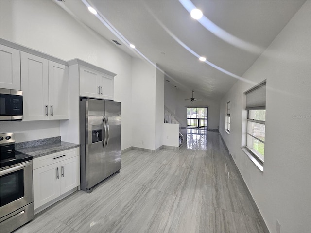 5802 Mohr Loop Unit 5802-5804-5806-5808, Tampa, FL 33615 - kitchen featuring stainless steel appliances, high vaulted ceiling, a ceiling fan, baseboards, and open floor plan
