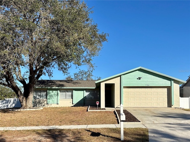 ranch-style house featuring a garage