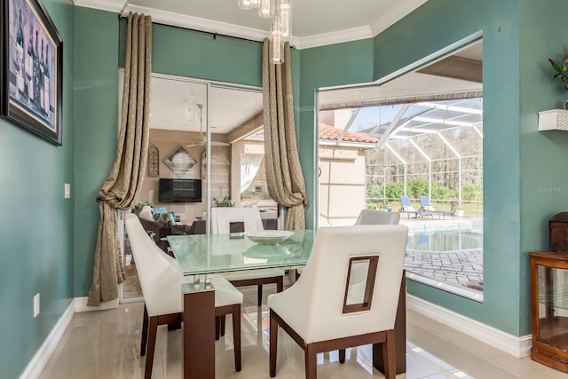 dining area with ornamental molding, a sunroom, and baseboards