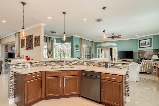 kitchen with backsplash, sink, and stainless steel dishwasher