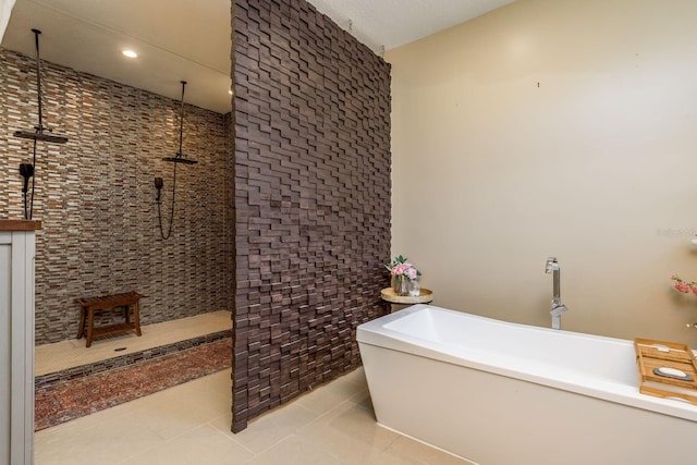 bathroom with tile patterned floors and separate shower and tub