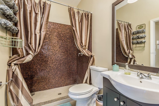 bathroom with a shower with curtain, vanity, and toilet