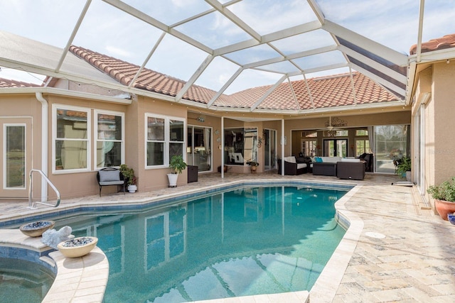 pool featuring a patio, a lanai, an outdoor living space, and a ceiling fan