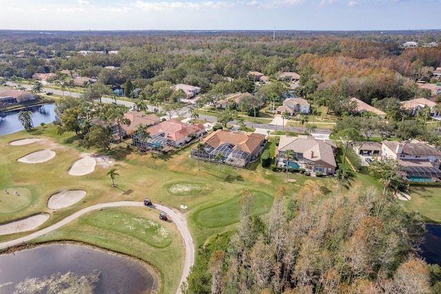 bird's eye view with a residential view, view of golf course, and a water view