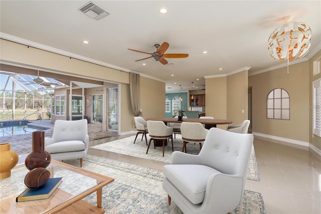 living room featuring light tile patterned floors, baseboards, visible vents, ornamental molding, and recessed lighting