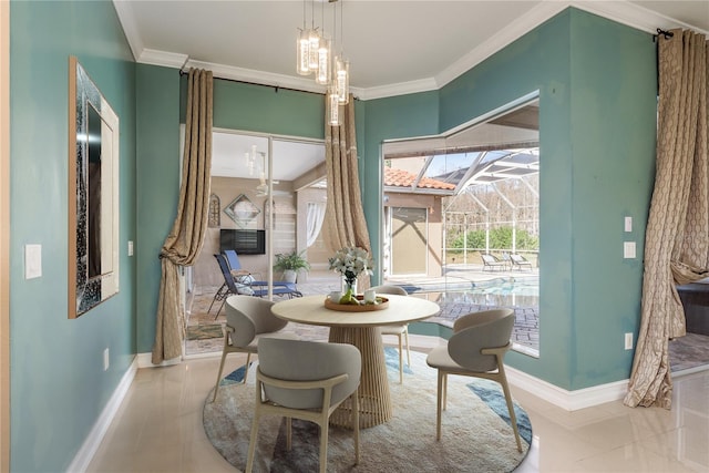 dining room with a sunroom, baseboards, ornamental molding, and a notable chandelier