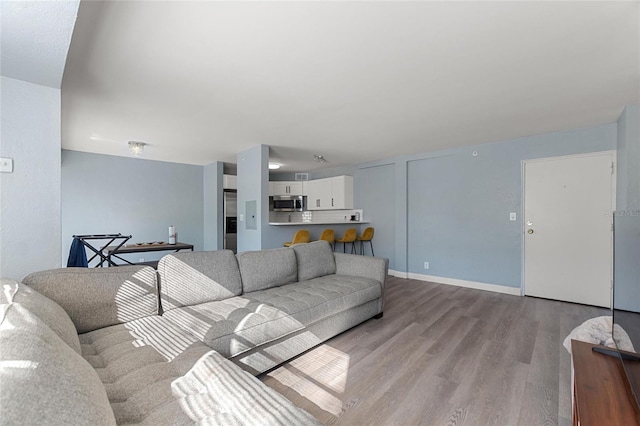 living room with light hardwood / wood-style floors