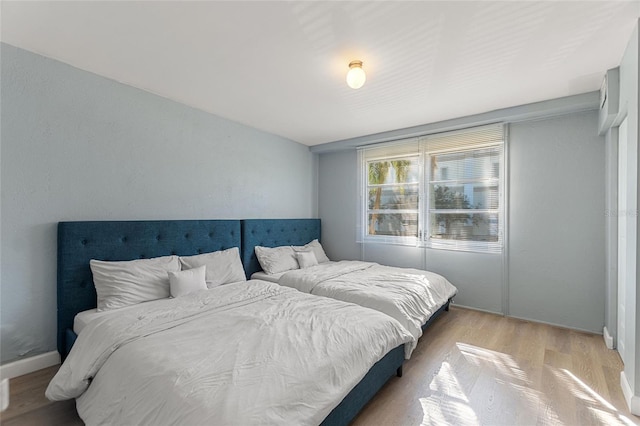 bedroom with light wood-type flooring