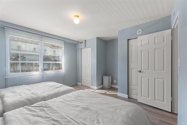 bedroom with light hardwood / wood-style floors