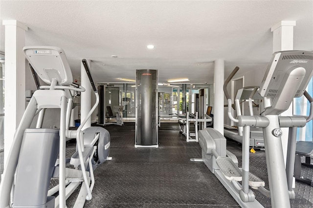 exercise room featuring a textured ceiling