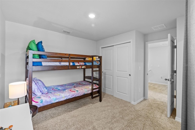 carpeted bedroom featuring a closet