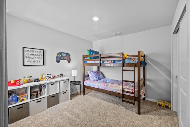 bedroom featuring carpet flooring and a closet