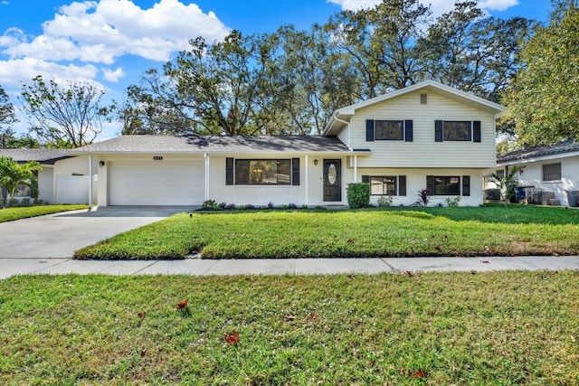 split level home featuring a garage and a front yard