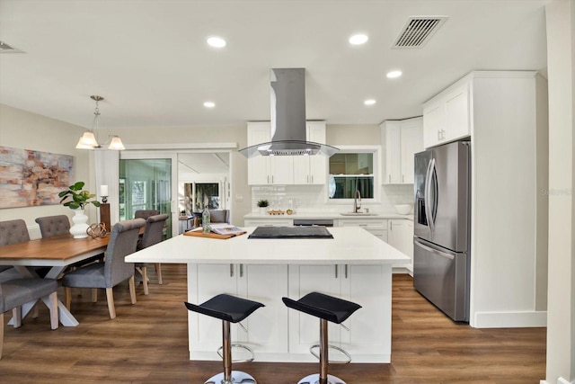 kitchen featuring island exhaust hood, stainless steel fridge with ice dispenser, a kitchen island, and white cabinets