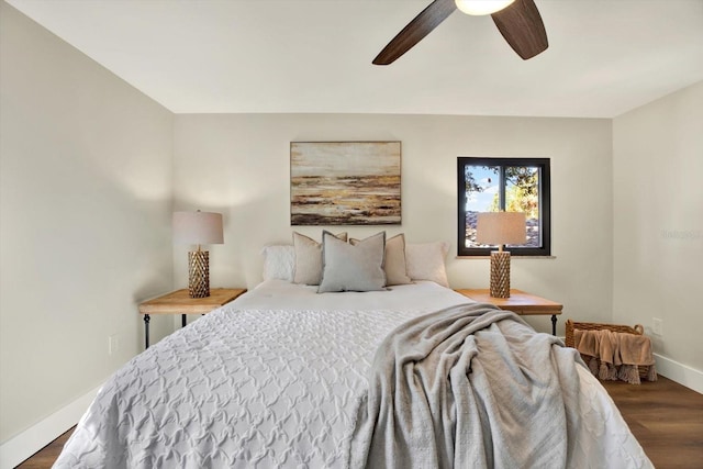 bedroom featuring ceiling fan and dark wood-type flooring