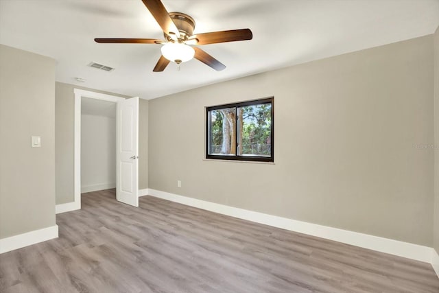 unfurnished bedroom with ceiling fan and light hardwood / wood-style flooring