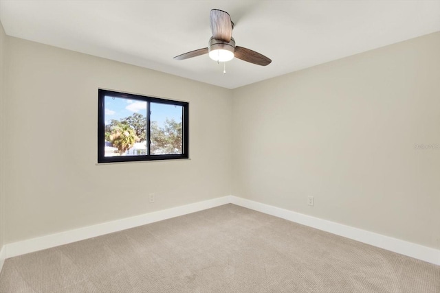 unfurnished room with light carpet and ceiling fan