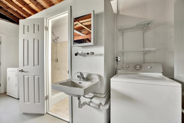 laundry area with washer / dryer and sink