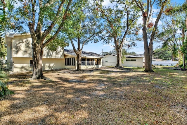 view of yard featuring a sunroom