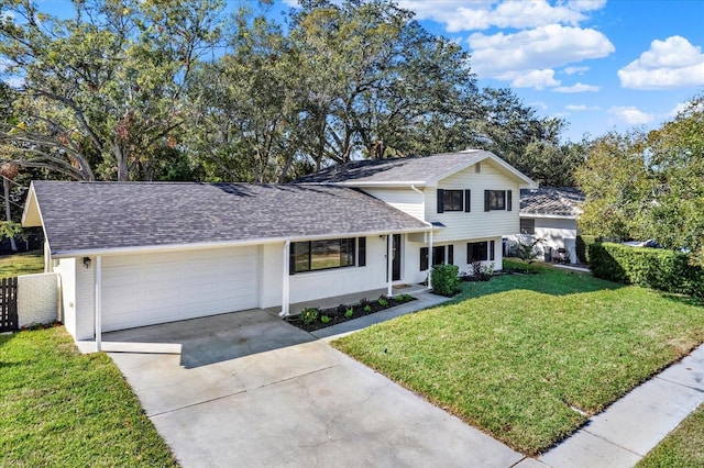 view of front of house with a garage and a front yard