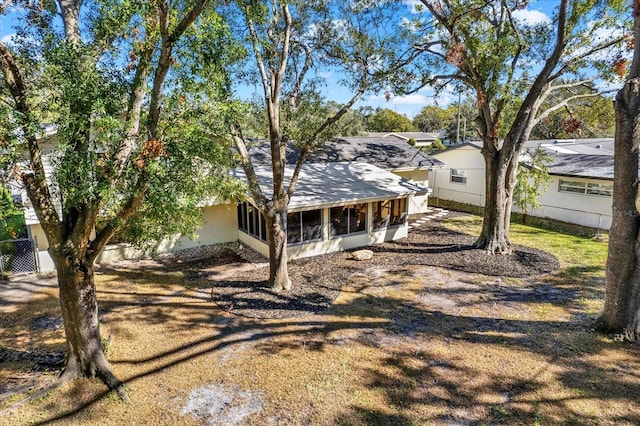 view of front of house with a sunroom