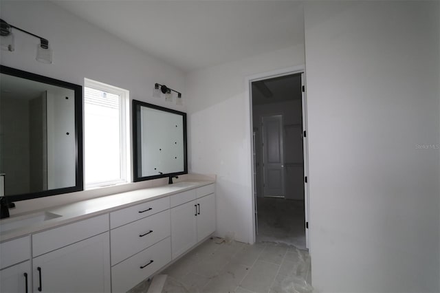 full bath featuring a sink and double vanity